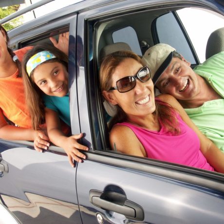 Family in car about to set out on a vacation.