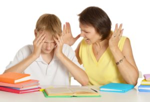 Mother is stressed about back-to-school and yelling at her son while trying to help with homework.